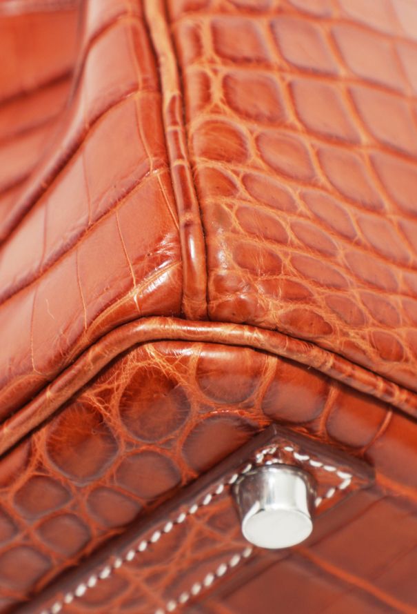 The red birkin crocodile bag is on our stone White birkin crocodile bag