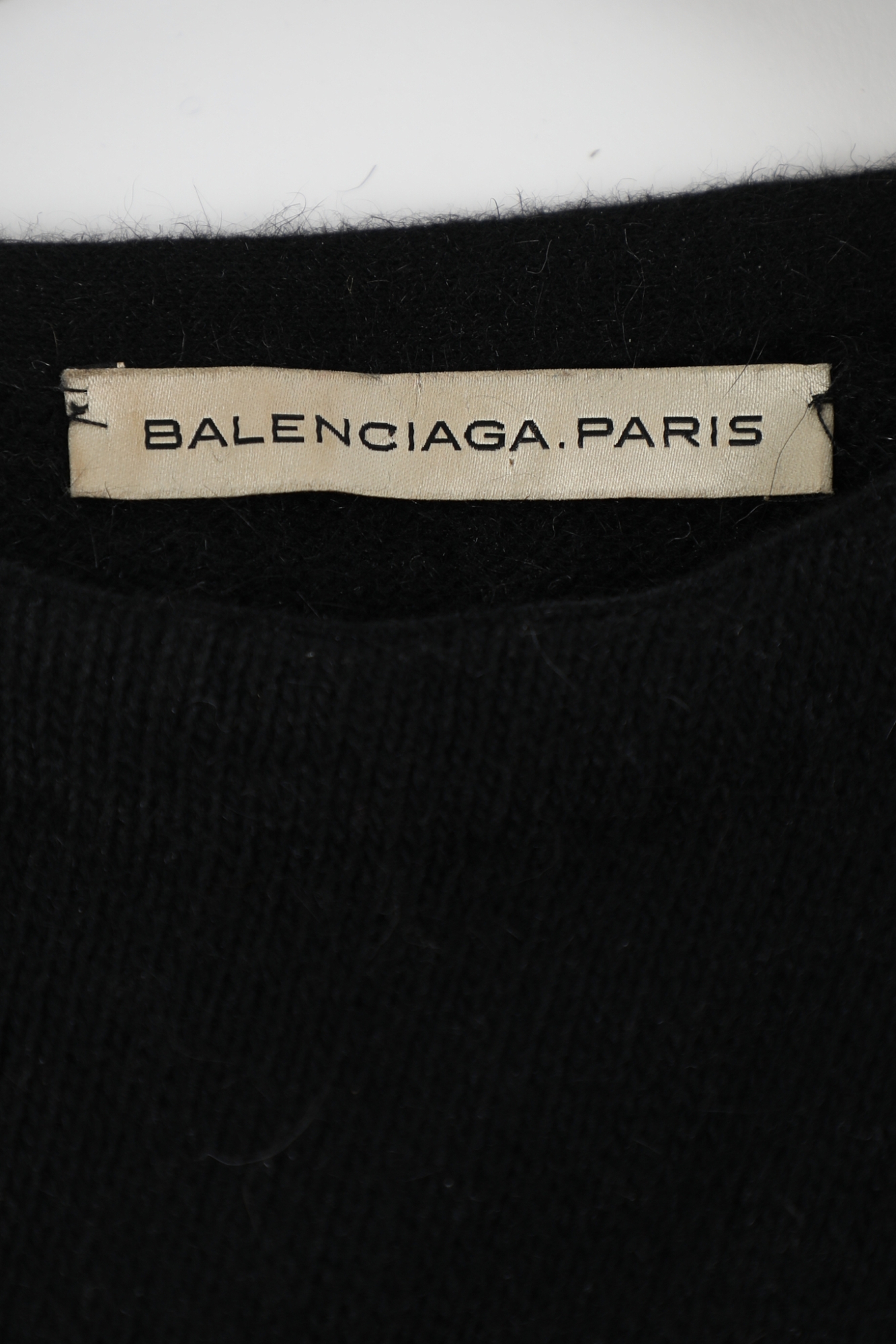 balenciaga black dress label Cristobal Balenciaga Day Dress. Label: BALENCIAGA 10, AVENUE GEORGE V PARIS  Autumn/Winter 1948. Black silk taffeta; fabric shawl-like wrap; belt as  part of dress; draped skirt. It reflects the trend of longing